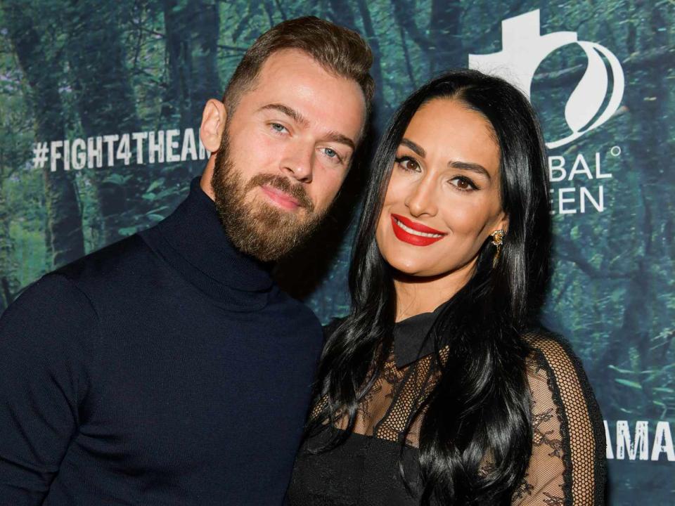 Artem Chigvintsev (L) and Nikki Bella attend the PUBG Mobile's #FIGHT4THEAMAZON Event at Avalon Hollywood on December 09, 2019 in Los Angeles, California