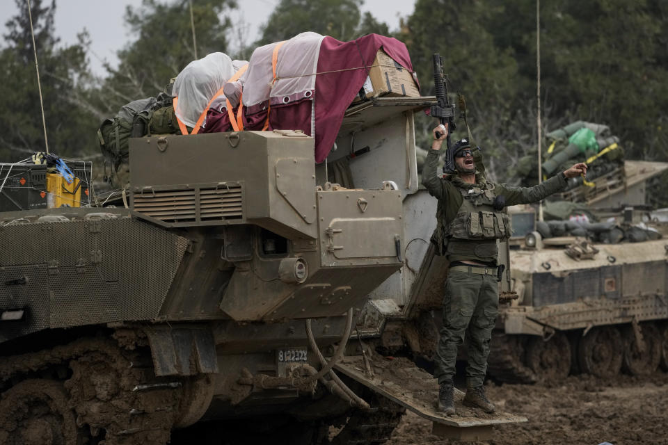An Israeli soldier reacts after returning from Gaza, at a staging area near the Israeli-Gaza border, in southern Israel, Thursday, Dec. 14, 2023. The army is battling Palestinian militants across Gaza in the war ignited by Hamas' Oct. 7 attack into Israel. (AP Photo/Leo Correa)
