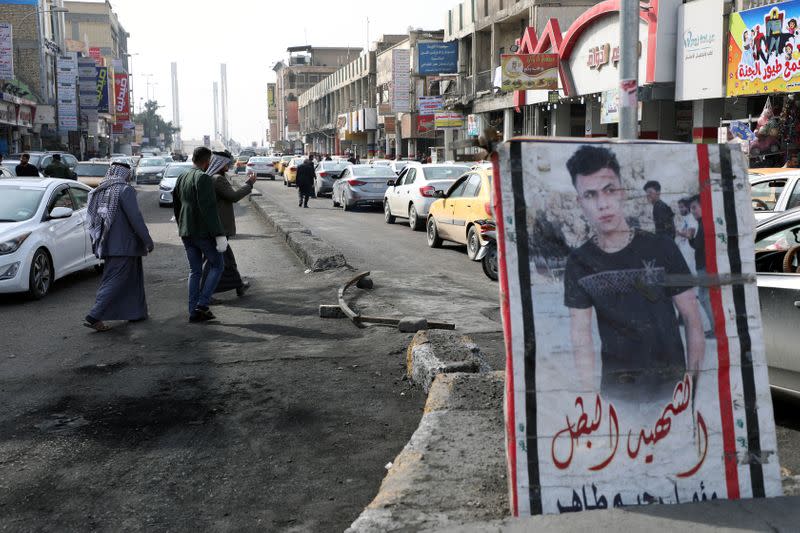 A picture of a demonstrator who was killed during anti-government protests, is seen in Nassiriya