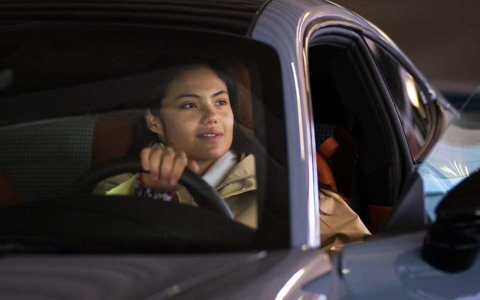 Emma Raducanu driving a Porsche