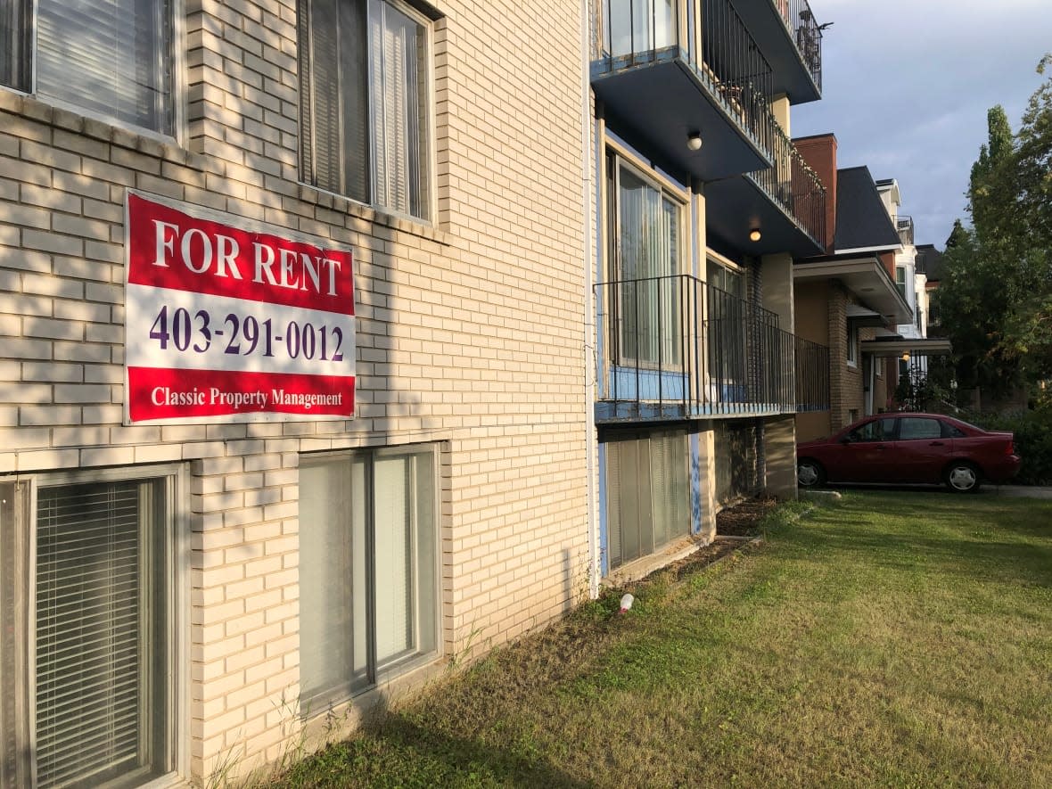 A rental sign is posted outside a Calgary apartment building in July 2022. (Paula Duhatschek/CBC - image credit)