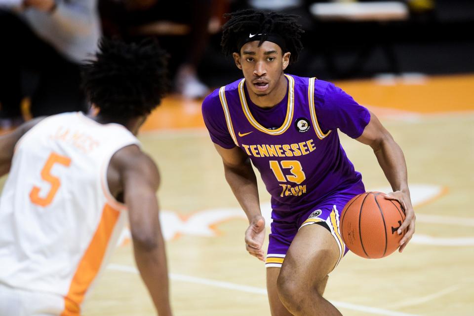 Tennessee Tech's Kenny White Jr. (13) drives down the court during a game between Tennessee Tech and Tennessee at Thompson-Boling Arena in Knoxville, Friday, Dec. 18, 2020.