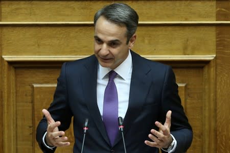 FILE PHOTO: Greek Prime Minister Kyriakos Mitsotakis speaks during a parliamentary session before a confidence vote on government policies in Athens