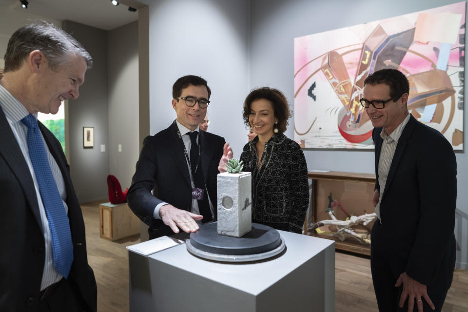 Director Hidde van Seggelen talks to UNESCO director Audrey Azoulay, center right, who visited the European Fine Art Foundation, known by its acronym TEFAF, in Maastricht, southern Netherlands, Thursday, March 7, 2024. (AP Photo/Peter Dejong)