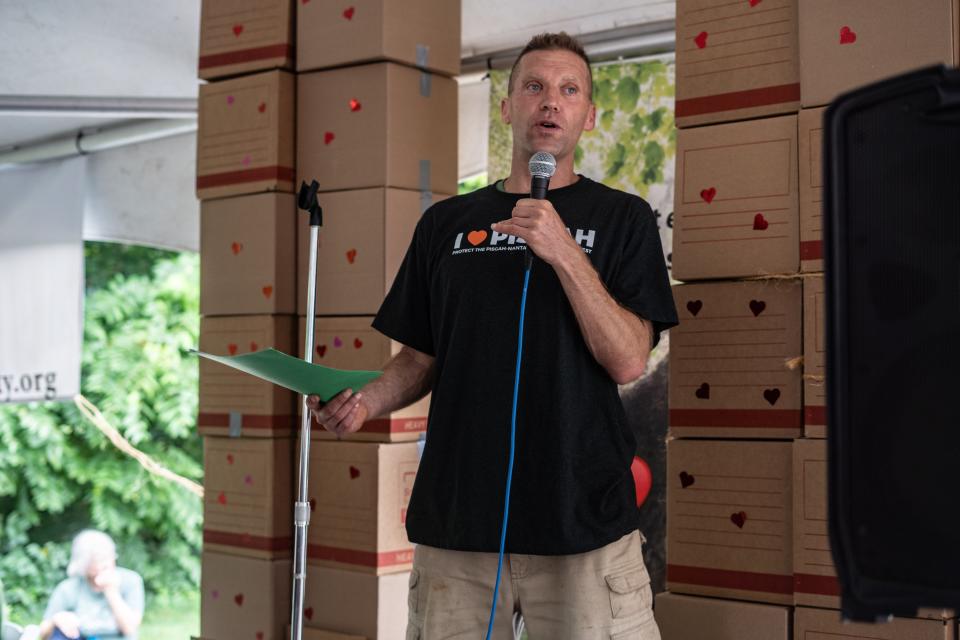 Organizer Will Harlan speaks at the Protect Pisgah Party and Rally outside of the National Forests in North Carolina's Forest Supervisor's office in Asheville on August 1, 2022.