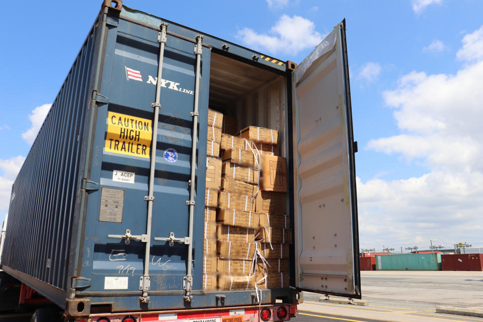 Officers of Customs and Border Protection inspect a shipment of hair pieces and accessories from China suspected to have been made with forced labor in June 2020 at the port of New York/Newark. (U.S. Customs and Border Protection)