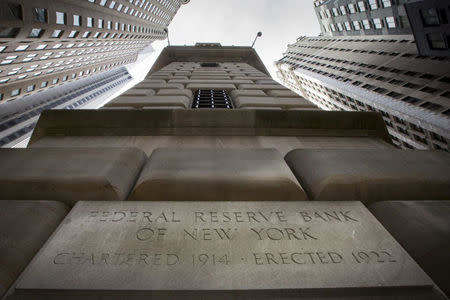 FILE PHOTO - The corner stone of The New York Federal Reserve Bank is seen surrounded by financial institutions in New York's financial district March 25, 2015. REUTERS/Brendan McDermid/File Photo