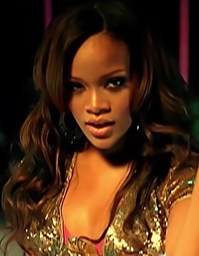 Rihanna dances in front of a crowd in her "Pon de Replay" video