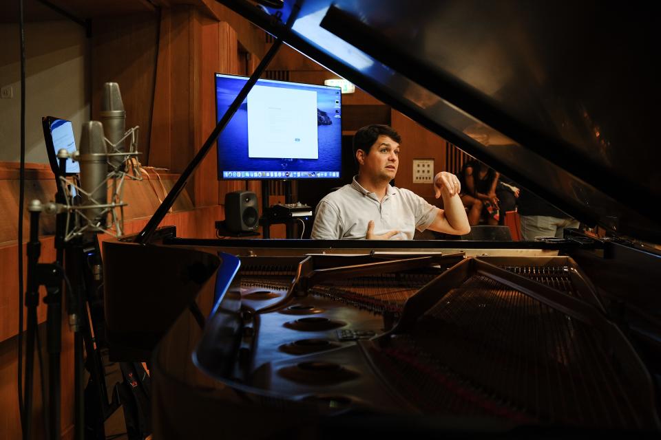 Composer J.J. Wright gives a direction during the recording of the Notre Dame Folk Choir's "The Passion" album, which was recorded in May 2022 at the Jerusalem Music Centre in Israel and will be released in February 2023.