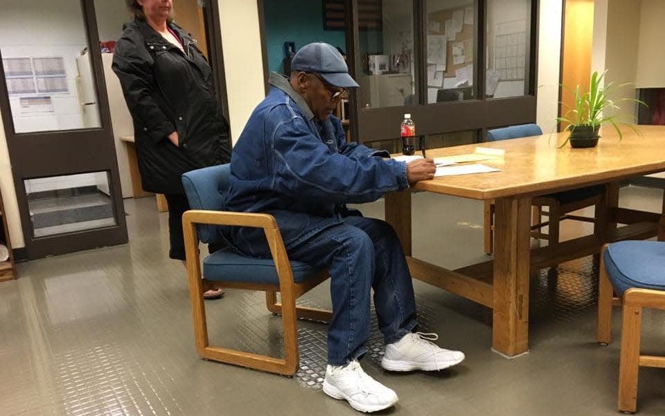 OJ Simpson signs his release forms at the  Lovelock Correctional Center in Nevada just a few hours ago. - NEVADA DEPARTMENT OF CORRECTIONS