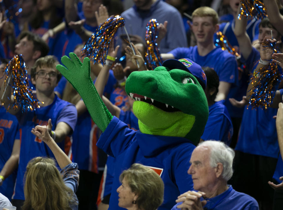 Florida mascot Albert celebrates with the fans during the second half of an NCAA college basketball game, Wednesday, Feb. 1, 2023, in Gainesville, Fla. Florida upset Tennessee 67-54. (AP Photo/Alan Youngblood)