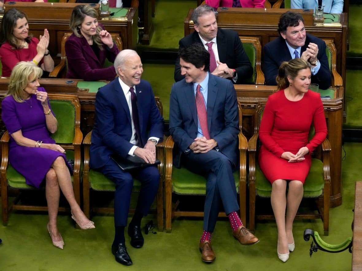 U.S. President Joe Biden, accompanied by First Lady Jill Biden, talks with Prime Minister Justin Trudeau, accompanied by his wife Sophie Gregoire Trudeau, before addressing Parliament on March 24, 2023 in Ottawa. (Andrew Harnik/Pool via AP Photo - image credit)