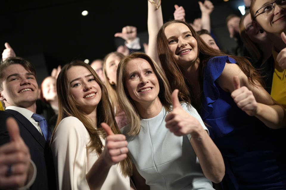 Members of the Reform Party and supporters of Prime Minister Kaja Kallas, centre, pose for photo in Tallinn, Estonia, Sunday, March 5, 2023. Voters in Estonia cast ballots Sunday in a parliamentary election that the center-right Reform Party of Prime Minister Kallas, one of Europe's most outspoken supporters of Ukraine, was considered a favorite to win. (AP Photo/Sergei Grits)