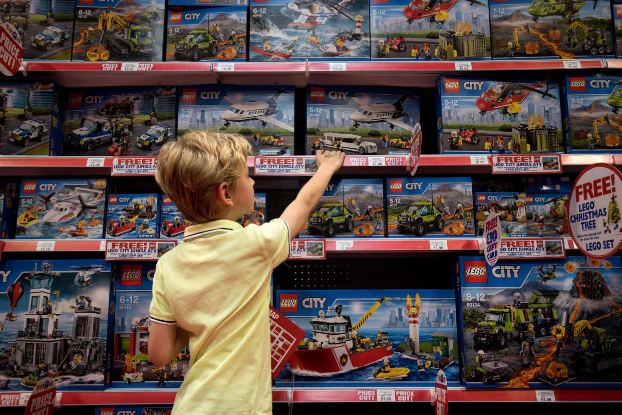 A young customer looks at Legos. (Photo by Aaron Chown/PA Images via Getty Images)