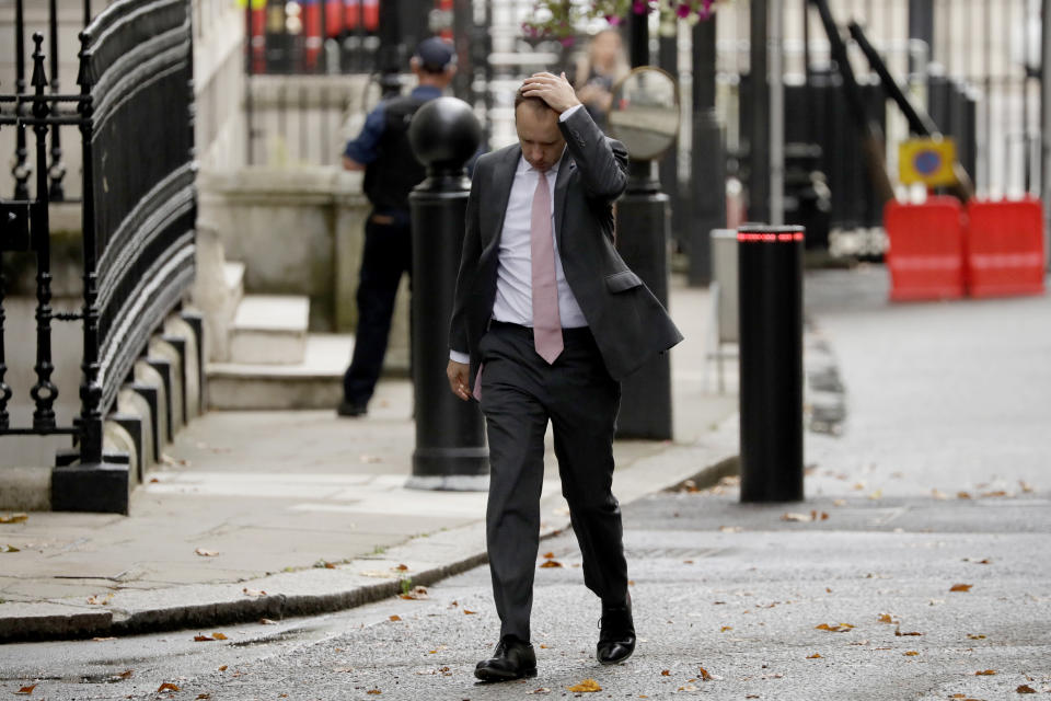 British Health Secretary Matt Hancock walks through Downing Street on his way into number 10, in London, Wednesday, Sept. 23, 2020. British Prime Minister Boris Johnson appealed Tuesday for resolve and a "spirit of togetherness" through the winter as he unveiled new restrictions on everyday life to suppress a dramatic spike in coronavirus cases. (AP Photo/Matt Dunham)