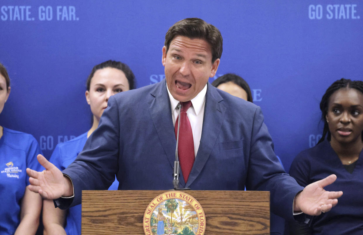 Florida Gov. Ron DeSantis answers questions during a news conference at Seminole State College in Sanford, Fla. Monday, May 16, 2022. DeSantis is at the school to announce $125 million in funding for nursing education. He said the state will likely take over Disney World's Reedy Creek Improvement District rather than local governments absorbing it after he signed a bill dissolving the longtime special tax district in April. (Joe Burbank/Orlando Sentinel via AP)