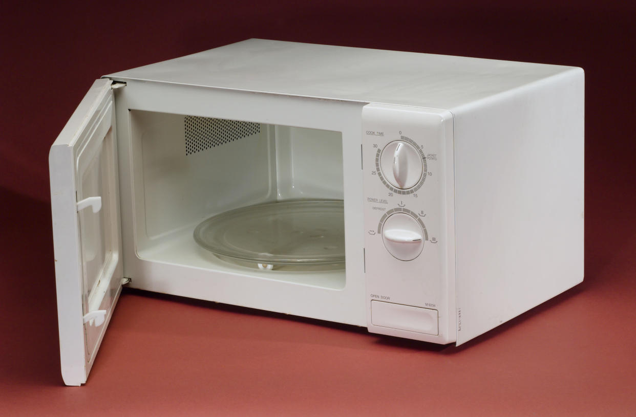 In response to a backpack ban, a student carried his books in a microwave. (Photo: SSPL/Getty Images)