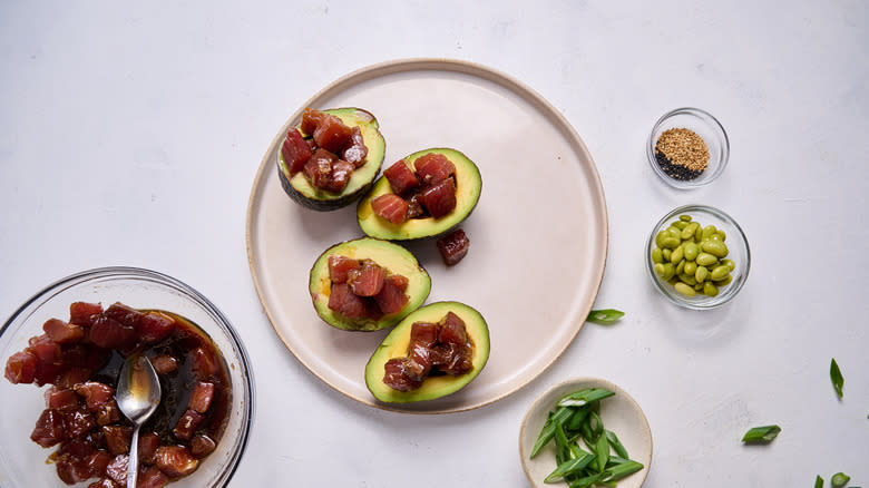 tuna stuffed avocados on plate