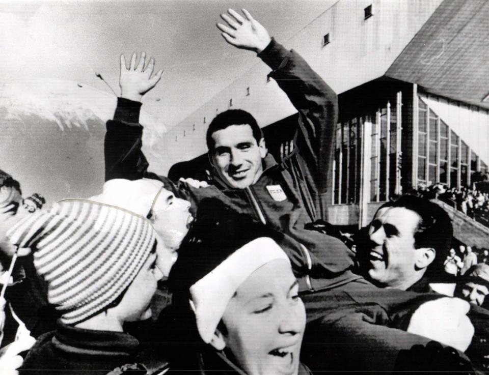 At age 23, Terry McDermott won a gold medal for the United States at the 1964 Winter Olympic Games in Innsbruck, Austria. He's seen here on the shoulders of teammates who helped celebrate his victory.