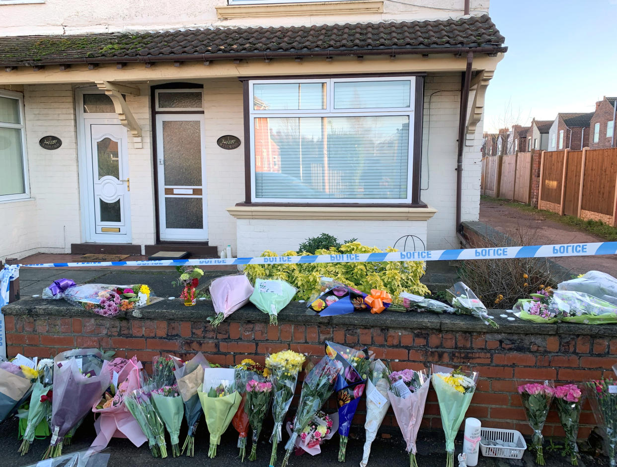 Flowers outside a house on Station Road, Langwith Junction, Shirebrook, near Bolsover, where Kenneth Walker 86, was found with life-threatening injuries alongside his wife Freda Walker 88, who was pronounced dead at the scene.