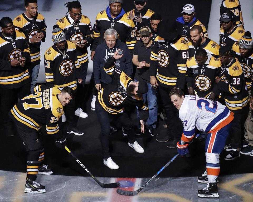<p>
              Super Bowl MVP and New England Patriots wide receiver Julian Edelman, center, spikes the puck during the ceremonial face-off between Boston Bruins center Patrice Bergeron (37) and New York Islanders left wing Anders Lee (27) prior to the first period of an NHL hockey game in Boston, Tuesday, Feb. 5, 2019. (AP Photo/Charles Krupa)
            </p>