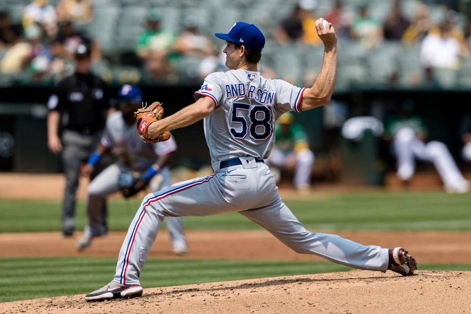 Texas Rangers starting pitcher Drew Anderson works against the Oakland Athletics during the second inning of a baseball game in Oakland, Calif., Saturday, Aug. 7, 2021. (AP Photo/John Hefti)