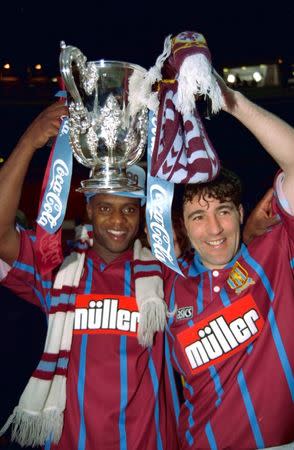 Britain Football Soccer - Aston Villa v Manchester United - Coca Cola Cup Final - 27/3/94 Aston Villa's Dalian Atkinson and Dean Saunders celebrate with the trophy Action Images via Reuters