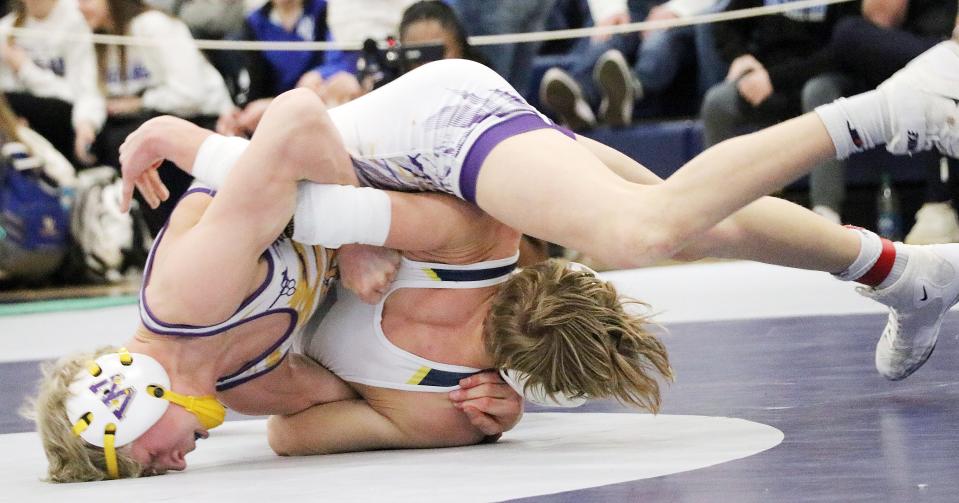 Watertown's Gage Lohr gets ready to put Tyler Woodring of Tea Area on his back during their 120-pound championship match in the Region 1A wrestling tournament on Saturday, Feb. 17, 2024 in Tea. Lohr won 14-6.