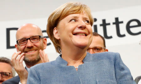 Christian Democratic Union CDU party leader and German Chancellor Angela Merkel reacts after winning the German general election (Bundestagswahl) in Berlin, Germany, September 24, 2017. REUTERS/Kai Pfaffenbach