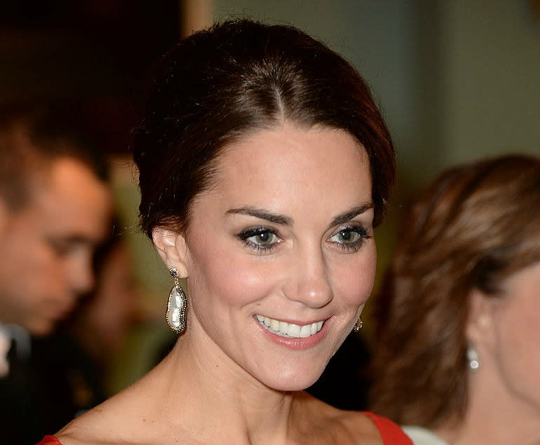 Kate Middleton is the dancing lady emoji brought to life in this dramatic red dress