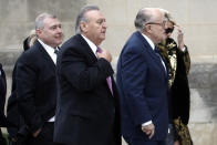 FILE - In this Dec. 5, 2018, file photo, Rudy Giuliani, foreground right, and others, including Lev Parnas, left, arrive for the state funeral for former President George H.W. Bush at the National Cathedral in Washington. Federal prosecutors are investigating former New York City mayor Rudy Giuliani, as part of a criminal case brought against his former associates, Lev Parnas and Igor Fruman, Soviet-born business partners from Florida who played key roles in Giuliani’s efforts to launch the Ukrainian corruption investigation against the Bidens. (AP Photo/Patrick Semansky, File)