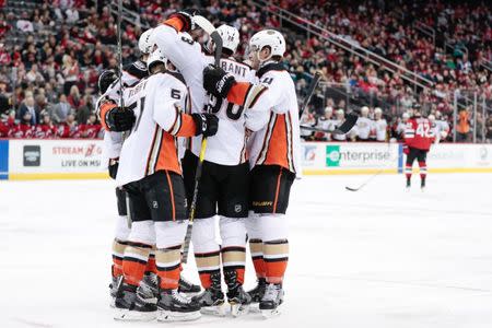Jan 19, 2019; Newark, NJ, USA; Anaheim Ducks center Derek Grant (38) celebrates his goal with teammates during the third period against the New Jersey Devils at Prudential Center. Mandatory Credit: Vincent Carchietta-USA TODAY Sports