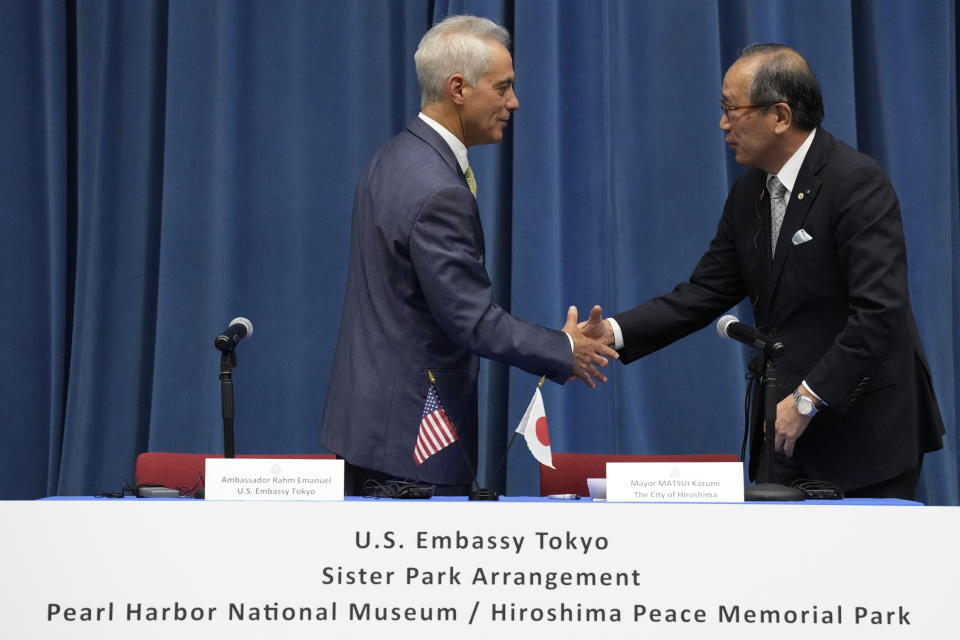 U.S. Ambassador to Japan Rahm Emanuel, left, and Hiroshima Mayor Kazumi Matsui shake hands after signing for a sister park arrangement between the Pearl Harbor National Memorial and the Hiroshima Peace Memorial Park at the U.S. Embassy Thursday, June 29, 2023 in Tokyo. (AP Photo/Eugene Hoshiko)