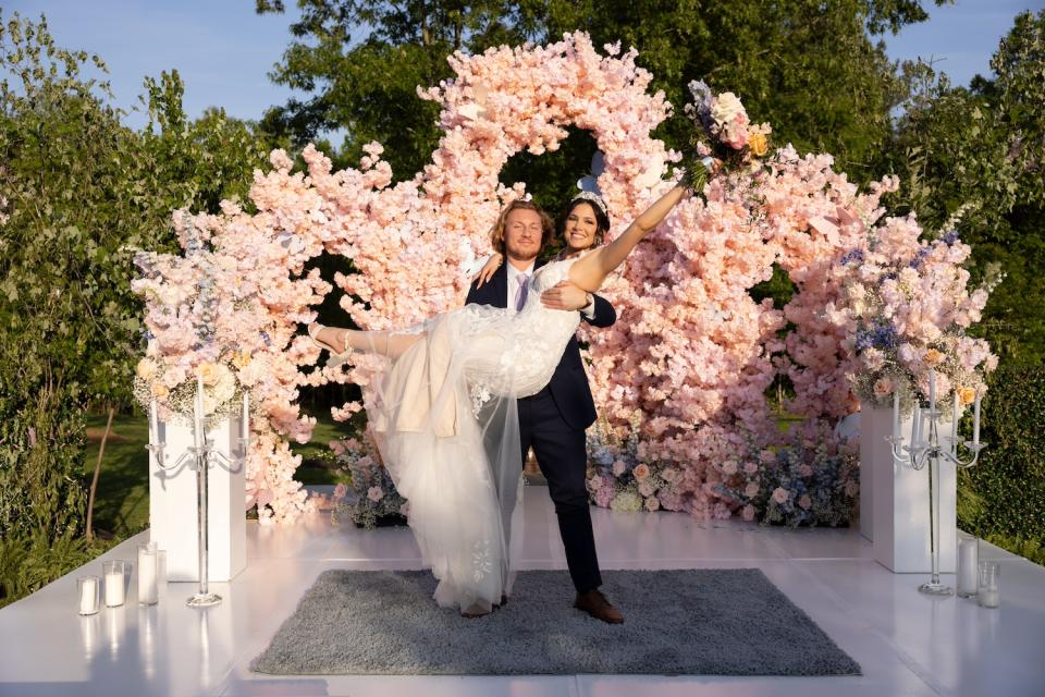 groom johnny holds bride amy on their wedding day, on 'love is blind' season 6