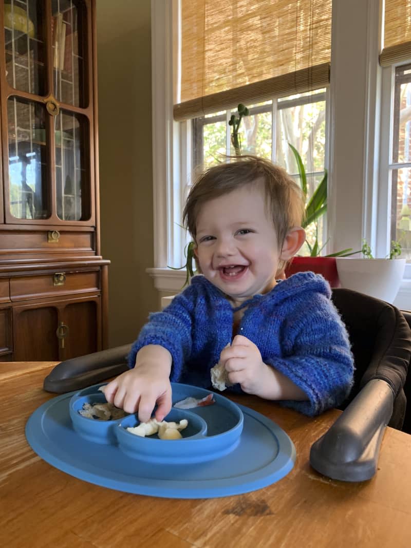 Toddler in a high seat.