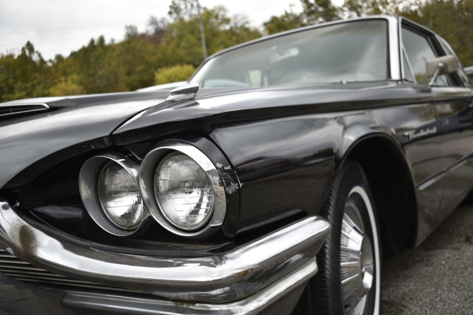 This vintage 1964 Ford Thunderbird is one of many vehicles parked outside Thurman Body Shop in Ellettsville. Owner Carl Thurman and son are working on it and have been for years.
