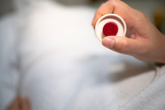 <p>Getty</p> A hospital patient presses an alert button.