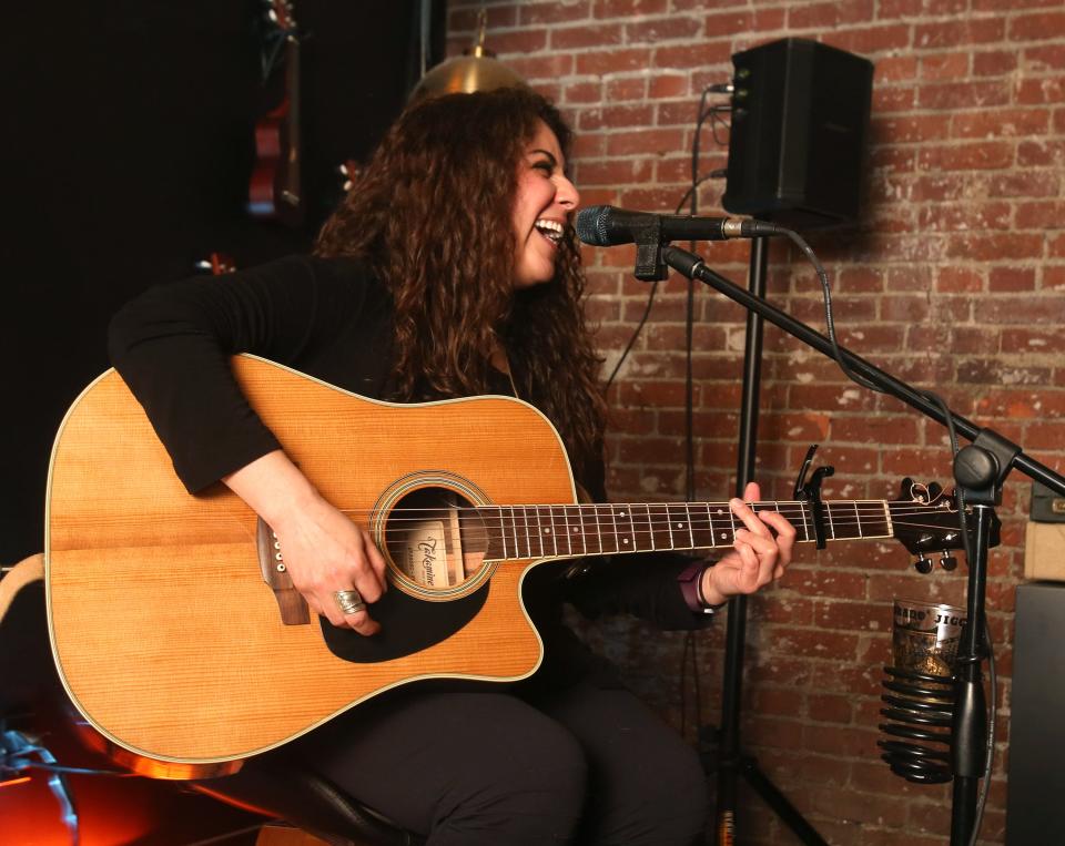 Tawnya Reynolds performs at Downtownhecks Tap Room in Massillon in late March. Reynolds was a contestant on u0022The Voiceu0022 television show in 2013.