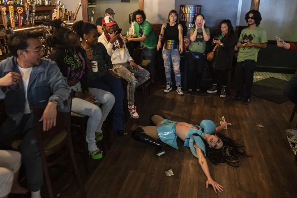 Baby Angel, performs a "death drop" during the "Mimosas & Heels Drag Brunch" at the Public House, Sunday, March 5, 2023, in Norfolk, Va. The drag bunch was hosted by Harpy Daniels and Javon Love. (AP Photo/Carolyn Kaster)