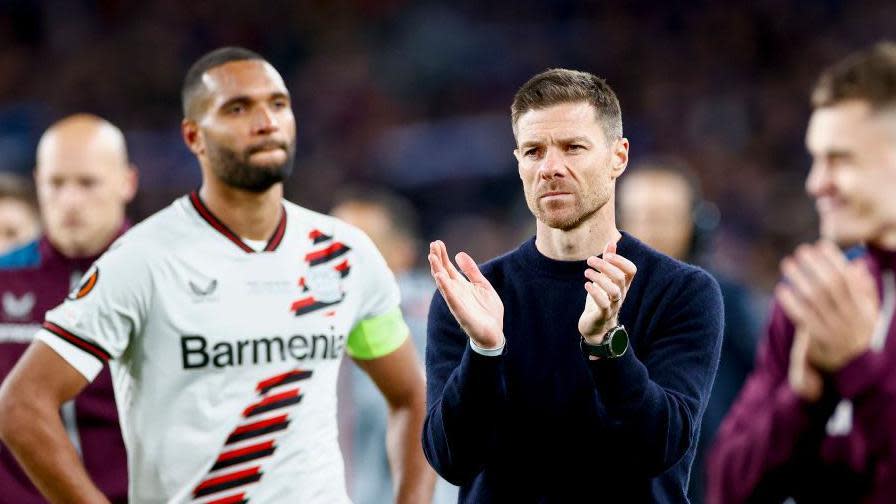 Bayer Leverkusen manager Xabi Alonso and his players look disappointed after losing the Europa League final