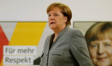 German Chancellor Angela Merkel arrives for a statement at the CDU headquarters in Berlin, Germany, January 21, 2017, after Germany's Social Democrats (SPD) voted to begin formal coalition talks with Chancellor Merkel's conservatives. REUTERS/Axel Schmidt