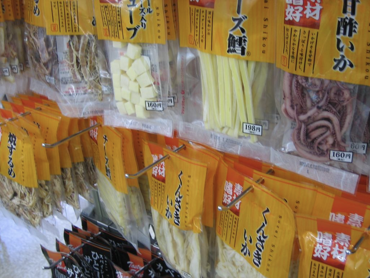 Japanese Snacks in packages hanging on store racks