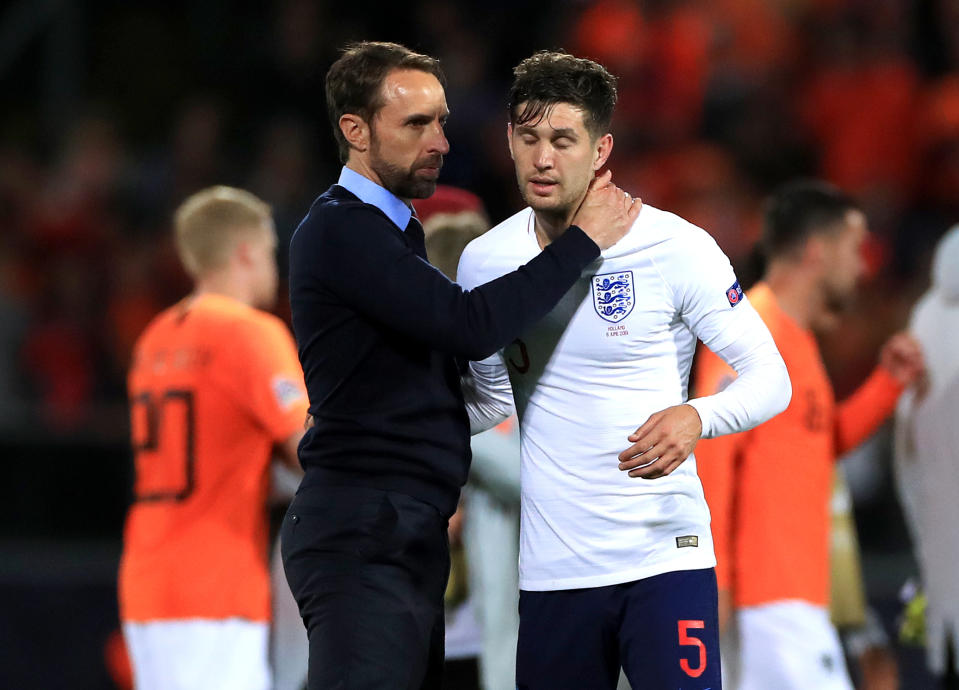 England head coach Gareth Southgate embraces John Stones after the Nations League Semi Final at Estadio D. Alfonso Henriques, Guimaraes.