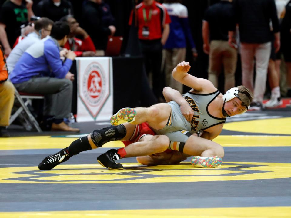 Hunter Rose, of New Lexington, tries to escape from Wauseon's Zaiden Kessler during the third round of consolation at 165 pounds on Saturday night in the Division II state tournament at Ohio State's Value City Arena in Columbus.