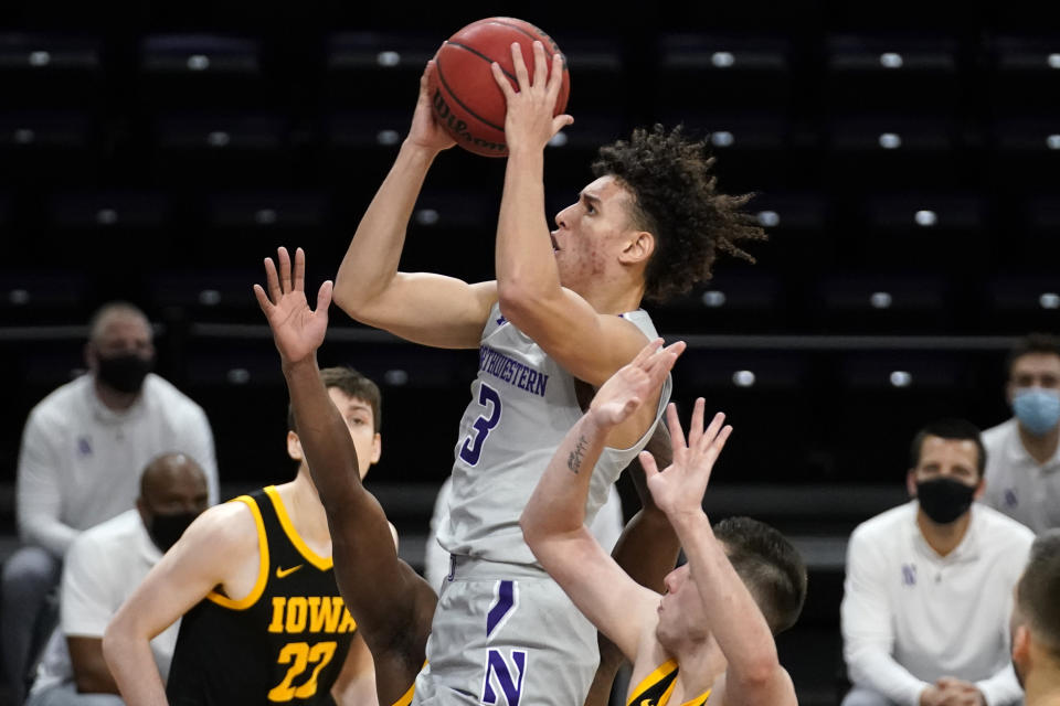 Northwestern guard Ty Berry drives to the basket against Iowa during the second half of an NCAA college basketball game in Evanston, Ill., Sunday, Jan. 17, 2021. (AP Photo/Nam Y. Huh)