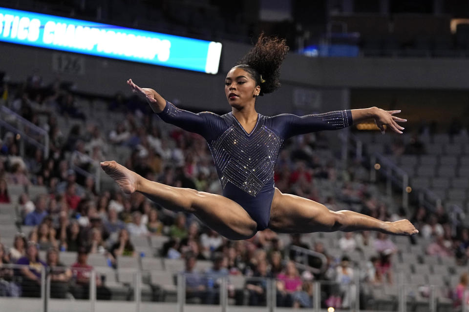 California's eMjae Frazier competes in the floor exercise during the NCAA women's gymnastics championships in Fort Worth, Texas, Thursday, April 18, 2024. (AP Photo/Tony Gutierrez)