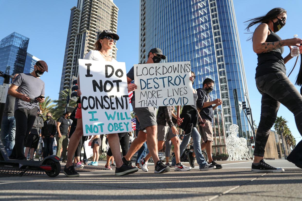 Business owners and local leaders participate in a rally at the County Administration Building on Nov. 16, 2020 in San Diego, California.