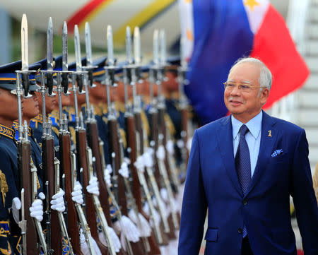 Malaysian Prime Minister Razak Najib reviews honour guards upon arrival at the Manila International Airport in Pasay city, metro Manila, Philippines April 27, 2017. REUTERS/Romeo Ranoco