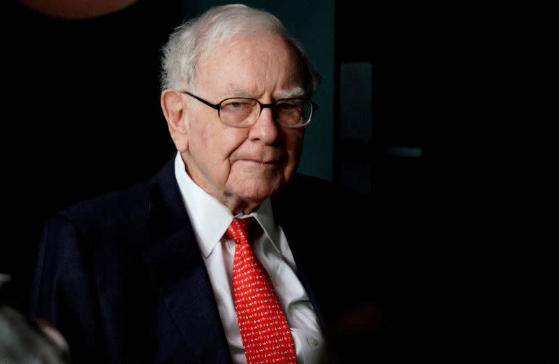 FILE PHOTO: Warren Buffett, CEO of Berkshire Hathaway Inc, pauses while playing bridge as part of the company annual meeting weekend in Omaha