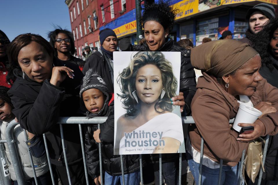 People gather outside New Hope Baptist Church during a private funeral for singer Whitney Houston on Feb. 18, 2012, in Newark, New Jersey.&nbsp; (Photo: STAN HONDA/AFP via Getty Images)